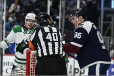  ?? AARON ONTIVEROZ — THE DENVER POST ?? Avalanche forward Mikko Rantanen jaws with referee Steve Kozari as the Stars’ Miro Heiskanen watches during the third period at Ball Arena in Denver on Feb. 15, 2022.