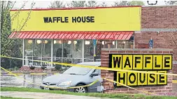  ?? MARK HUMPHREY/THE ASSOCIATED PRESS ?? Police tape blocks off a Waffle House restaurant where at least four people died after a gunman opened fire Sunday morning in Nashville.