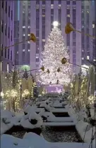  ?? Getty images file ?? Rockefelle­r center is seen in the snow on thursday.