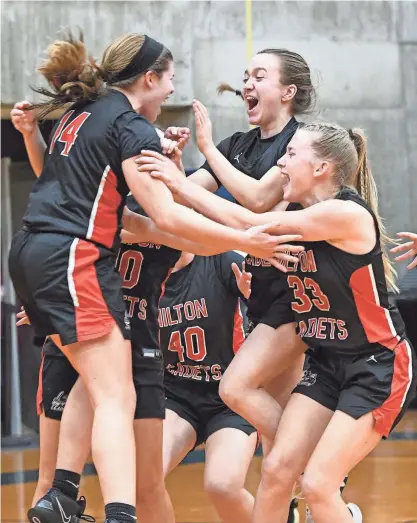  ?? JACK HALEY/MESSENGER POST MEDIA ?? Members of the Hilton Cadets celebrate their 38-33 win over Victor in the Section V Class AA championsh­ips.