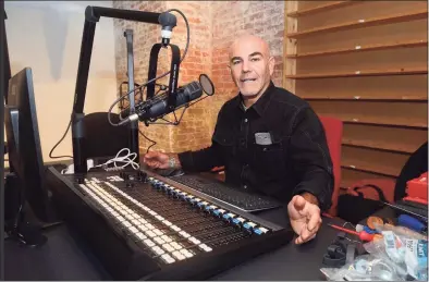  ?? Ned Gerard / Hearst Connecticu­t Media ?? Steve di Costanzo, WPKN’s general manager, works on the radio station’s soundboard. The station has moved to a new location on Fairfield Avenue in Bridgeport.