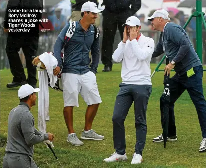  ??  ?? Game for a laugh: Rory McIlroy shares a joke with Tiger Woods yesterday GETTY