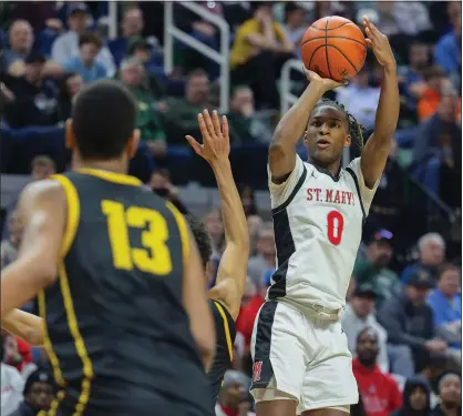  ?? PHOTOS BY TIMOTHY ARRICK — FOR MEDIANEWS GROUP ?? Orchard Lake St. Mary’s guard Sharod Barnes, pictured here shooting a jumper in Saturday’s Division 1state title game against North Farmington, returns alongside star Trey McKenney and fellow starter Jayden Savoury to boost the Eaglets’ attempts of a title repeat next season.