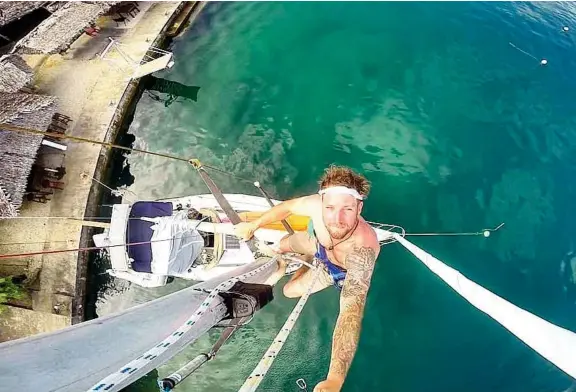  ??  ?? Changing a lightbulb on the mast requires hoisting up in the Bosun's chair and taking a selfie