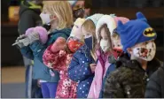  ??  ?? Students in the 5day pre-K class at Immanuel Unite Church of Christ line up to go outside after helping to sort donated food items. At the Immanuel United Church of Christ in Shillingto­n Monday morning January 18, 2021 during a program for Martin Luther King Jr. Day with the church and the Jewish Federation of Reading.