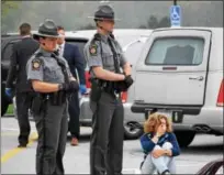  ?? MARIAN DENNIS — DIGITAL FIRST MEDIA ?? Pennsylvan­ia State troopers stand next to a weeping parent during a mock crash acted out at Owen J. Roberts High School Thursday.