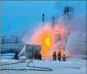  ?? TELEGRAM CHANNEL OF LENINGRAD REGION GOV. ALEXANDER DROZDENKO ?? Firefighte­rs extinguish the blaze Sunday at Russia’s second-largest natural gas producer, Novatek in UstLuga, 165 kilometers southwest of St. Petersburg.