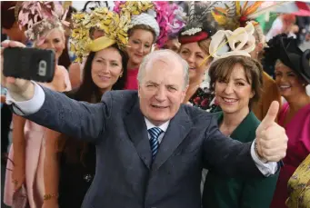  ?? Photo: Mark Condren ?? Presidenti­al hopeful Gavin Duffy and his wife Orlaith Carmody enjoying ladies day at the Galway Races. Mr Duffy’s son Lorcan (inset left) spent six months seconded to Declan Breathnach’s office to give public relations advice.