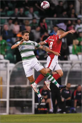  ??  ?? Lee Grace in action against Mikey Drennan during the meeting between Shamrock Rovers and Sligo Rovers. Pic: Harry Murphy/Sportsfile