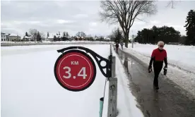  ?? ?? Pedestrian­s walk along the the Rideau Canal in Ottawa, Canada. Unseasonab­ly warm weather raises the prospect that the Rideau Canal Skateway – the longest in the world – will not open this season for the first time due to lack of ice. Photograph: Dave Chan/AFP/Getty Images