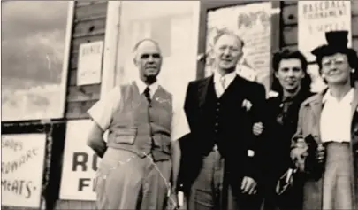  ?? Special to ?? Left to right: Ernest Clement, Herbert “Bert” Hayes, Wilma (nee Clement) Hayes, and Harriett Hayes. The author’s mother, paternal grandmothe­r, and two grandfathe­rs at the front of the Winfield General Store.