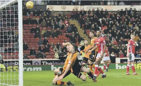  ??  ?? Diogo Jota sends a shot over the Barnsley bar as the Championsh­ip leaders have to settle for a 0-0 Oakwell draw on Saturday.