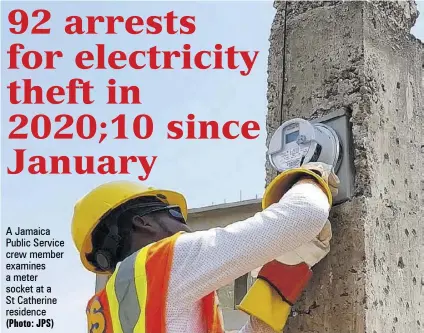  ?? (Photo: JPS) ?? A Jamaica Public Service crew member examines a meter socket at a St Catherine residence