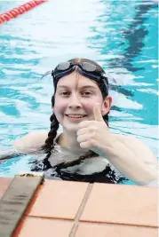  ??  ?? Dakota Dawson gives her event the thumbs up after finishing first in the under 15 freestyle at the Neerim pool.