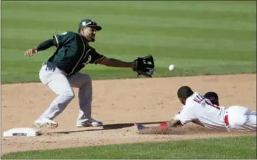  ?? TONY DEJAK — ASSOCIATED PRESS ?? Greg Allen slides safely into second base for a steal as the Athletics’ Marcus Semien waits for the ball in the fifth inning on July 7.