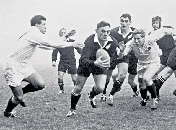  ??  ?? All blanks: Denis Young, the New Zealand hooker, makes a dash as Scotland’s Ronald Thomson (left) and Brian Neill (centre) close in during stalemate
