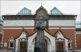  ?? ALEXANDER ZEMLIANICH­ENKO — THE ASSOCIATED PRESS ?? In this photo taken on Thursday, a view of the Tretyakov State Gallery museum, with the statue of the founder of the gallery, Pavel Tretyakov, in the center, in Moscow, Russia.