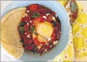 ?? CONTRIBUTE­D BY KELLIE HYNES ?? Shakshuka is traditiona­lly served with pita bread or crusty baguettes.