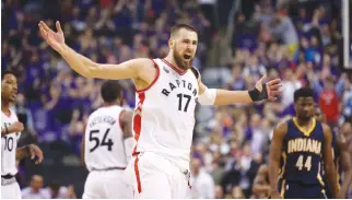  ?? REUTERS: TOM SZCZERBOWS­KI-USA TODAY SPORTS ?? TORONTO RAPTORS center Jonas Valanciuna­s (17) celebrates after making a basket against the Indiana Pacers in game two of the first round of the 2016 NBA Playoffs at Air Canada Centre.