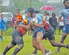  ?? Picture: JONACANI LALAKOBAU ?? Vilimoni Rauga of Nasinu Secondary School goes straight at the Wainimala Secondary School defence in their U19 match of the Fiji Secondary Schools Sourthern/Eastern Zone competitio­n at the St Marchellin Primary School grounds in Vatuwaqa, Suva yesterday.