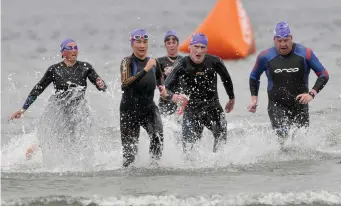  ??  ?? Swimmers racing to the finish line at the Metalman Swim Series in Rosses Point. Pics: Carl Brennan.