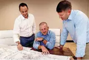  ?? [THE OKLAHOMAN ARCHIVES] ?? Valiant Midstream executives Brandon Webster, left, Chad Cagle and Zach Gray look over maps at their office in north Oklahoma City.