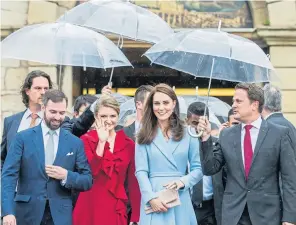  ??  ?? The Duchess is accompanie­d by Prince Guillaume, left, and Princess Stephanie