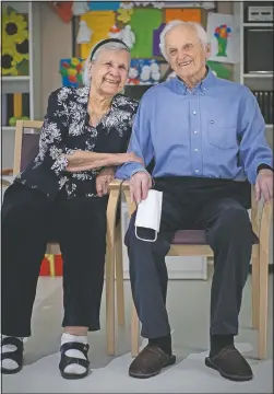  ?? (AP/Alexander Zemlianich­enko) ?? Boris Novikov poses for a photo with his wife, Yelena, at a senior care center just outside Moscow.