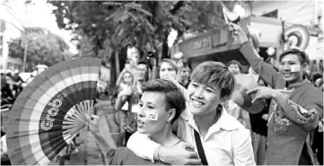  ??  ?? Participan­ts gather for a gay pride parade to advocate gay rights in Hanoi. — AFP photo