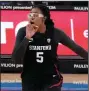  ?? (AP/Marcio Jose Sanchez) ?? Forward Francesca Belibi reacts Monday after dunking during the second half of top-ranked Stanford’s 61- 49 victory over UCLA in Los Angeles.