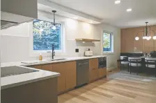  ?? ?? The Centennial Kitchen & Bath team transforme­d this '80s-style kitchen into a bright, modern space. The kitchen won a 2024 Housing Excellence Award for Best Kitchen Renovation under $50,000.