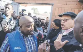 ??  ?? NOT WELCOME. The DA’s John Moodey, right, and ward councillor Abel Tau were refused access to conduct a site visit yesterday.