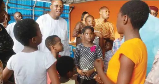  ??  ?? Celebrant, Adebowale Ogunkoya (middle) dancing with some children of Heart of Gold Children Hospice in Lagos, to mark his 60th birthday…recently