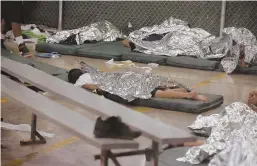  ?? AP FILE PHOTO ?? FEW OPTIONS: Young boys sleep in a holding cell where hundreds of mostly Central American immigrant children are being processed and held in Nogales, Ariz.