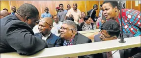  ?? Picture: MICHAEL PINYANA ?? SEEKING JUSTICE: Advocate Mike Maseti, left, with his clients Thembelani Sali, Vincent Pillay, Mathew Moodley and Luleka Simon-Ndzele at the East London Magistrate’s Court recently