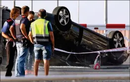  ??  ?? AFTERMATH: Car used by attackers lies overturned in Cambrils