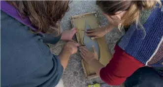  ??  ?? Lockdown guest Nikki and me, pressing the plug into the clay half-mould