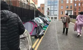  ?? Photograph: Rory Carroll/The Guardian ?? Asylum seekers camp in a lane beside Ireland's Internatio­nal Protection Office in Dublin.