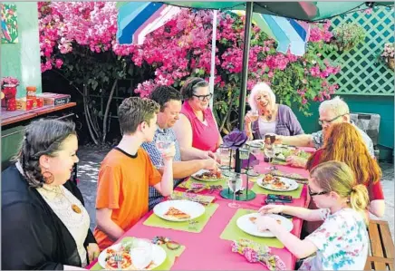  ?? Photograph­s by Eduardo Contreras San Diego Union-Tribune ?? THREE GENERATION­S of the Haven family gather in the courtyard of a San Diego apartment building remade for themselves.