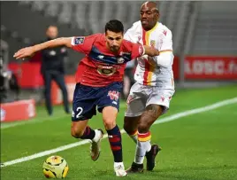  ?? (Ph. AFP) ?? Entre Lille et Lens (Celik et Kakuta ci-dessus), c’est toujours tendu.