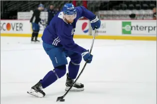  ?? JOHN LOCHER — THE ASSOCIATED PRESS ?? Colorado Avalanche center Nathan MacKinnon (29) hits a shot during Friday’s practice ahead of Saturday’s Game 2 of the Stanley Cup Final in Denver.