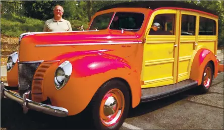  ?? PHOTO BY DAVID KRUMBOLTZ ?? Walnut Creek resident Gerry Ghio poses for a photo next to his 1940Ford De Luxe woody station wagon.