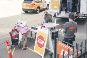  ?? DUSTIN BROWN ?? This June 25, 2020 photo shows an APSCA pet food distributi­on point in the Bronx borough of New York. Animal welfare organizati­ons are increasing their efforts to help people affected financiall­y by the pandemic care for their pets.