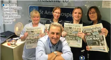  ??  ?? ●»St Ann’s chief executive Eamonn O’Neal with staff and their favourite papers!