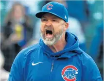  ?? JOHN J KIM/CHICAGO TRIBUNE ?? Cubs manager David Ross yells at home-plate umpire Cory Blaser after a strike call in the ninth inning Saturday.