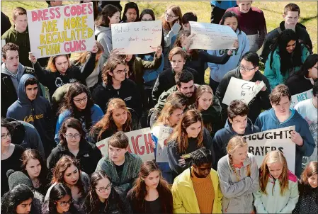  ?? DANA JENSEN/THE DAY ?? Williams School students listen to a speaker during a gun violence protest on National School Walkout Day on Friday. The event, held across the street from the school, was hosted by Williams’ Political, Social Justice, Awareness Club. Visit theday.com...