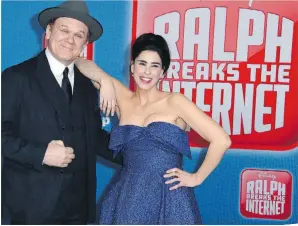  ?? JORDAN STRAUSS/THE ASSOCIATED PRESS ?? Comedian Sarah Silverman, right, says she was excited to return to the vocal booth to record with Ralph Breaks the Internet co-star John C. Reilly.