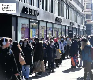  ??  ?? Shoppers outside Debenhams