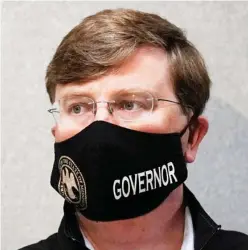  ??  ?? Mississipp­i Gov. Tate Reeves listens as state emergency management executive director Greg Michel speaks during his news briefing at the Mississipp­i Emergency Management Headquarte­rs in Pearl, Miss., Monday, Aug. 24, 2020. (Photo by Rogelio V. Solis, AP)