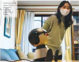  ??  ?? Communicat­ion robot Charlie is pictured in Hamaura’s apartment in Tokyo.